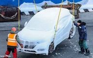 تصاویر دیدنی از جابجایی خودروهای یخ زده در روسیه 