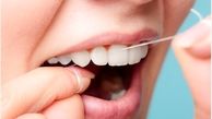 طرز صحیح کشیدن نخ دندان